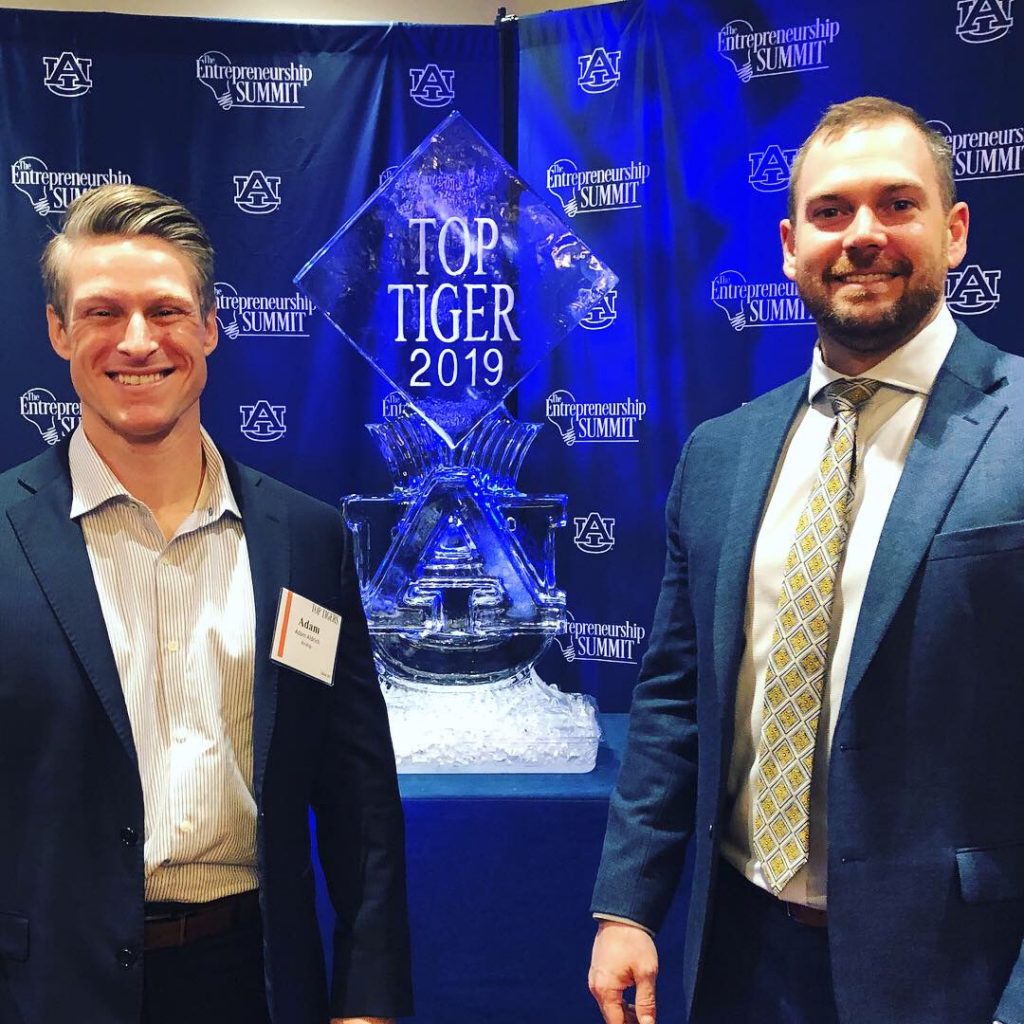 Trent Kocurek, CEO/Co-founder and Auburn University Alum (right), and Adam Aldrich, President / Co-founder (left), attend the 2019 Top Tigers awards luncheon at Auburn University
